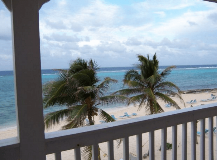 free trip Grand Cayman Caribbean island vacation getaway win gift cards airfare vacation deals