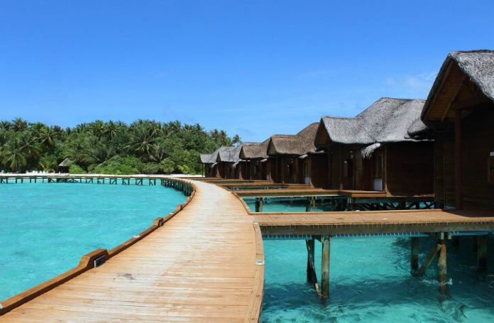 Maldives beach vacation savings Olhuveli Beach & Spa Resort 55% off