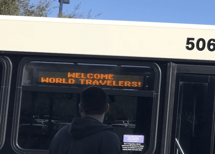 Disney World bus with Welcome World Travelers message