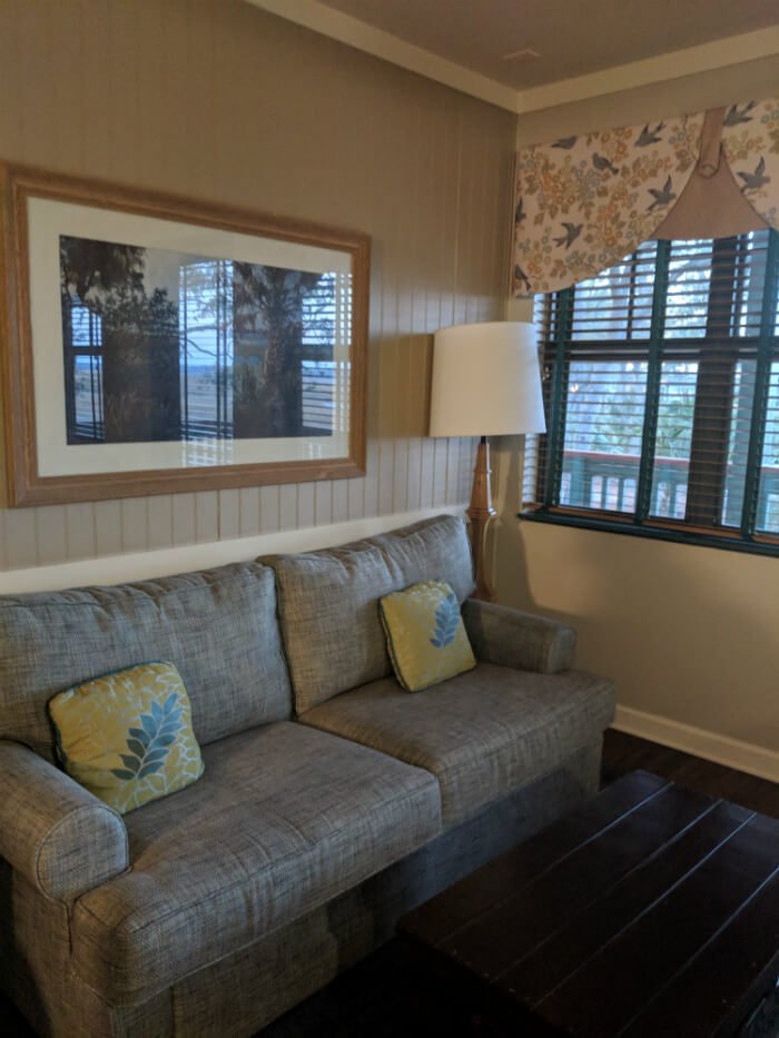 sofa in living room of one bedroom suite in Disney's Hilton Head Island Resort