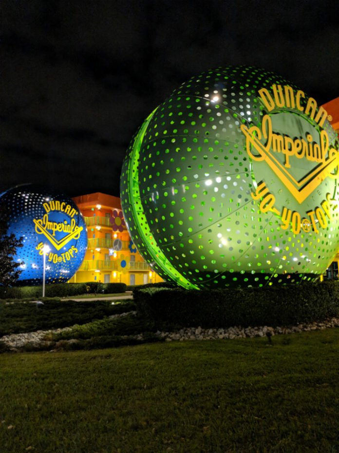 Disney's Pop Century Resort building and giant Duncan Imperial Yo Yo Tops