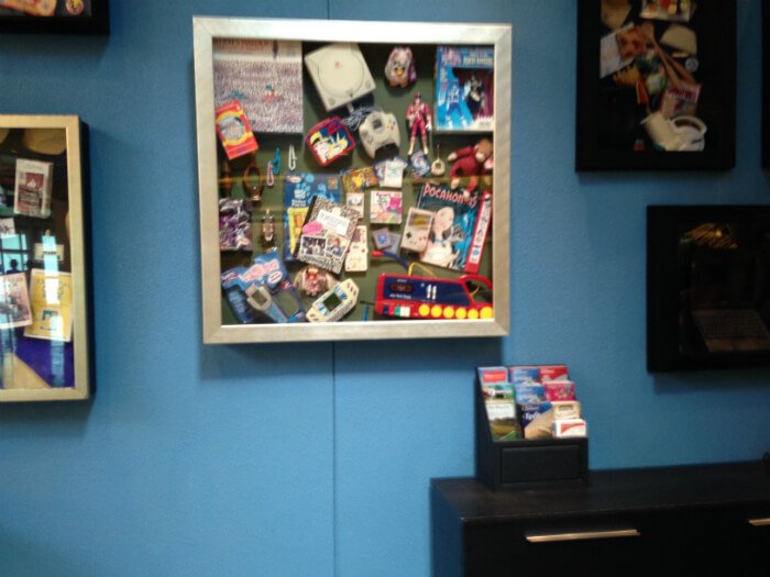 Disney's Pop Century Resort hotel lobby with collage of Pocahontas, Game Boy, 90s nostalgia