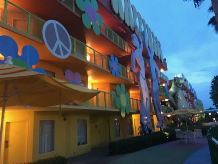 exterior of hotel building at Pop Century resort with peace sign, flowers, happiness, Baloo