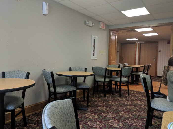 breakfast area with tables and chairs at Country Inn & Suites Williamsburg East Busch Gardens