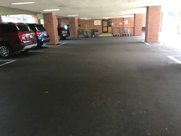 large covered parking lot at Country Inn & Suites Williamsburg East Busch Gardens