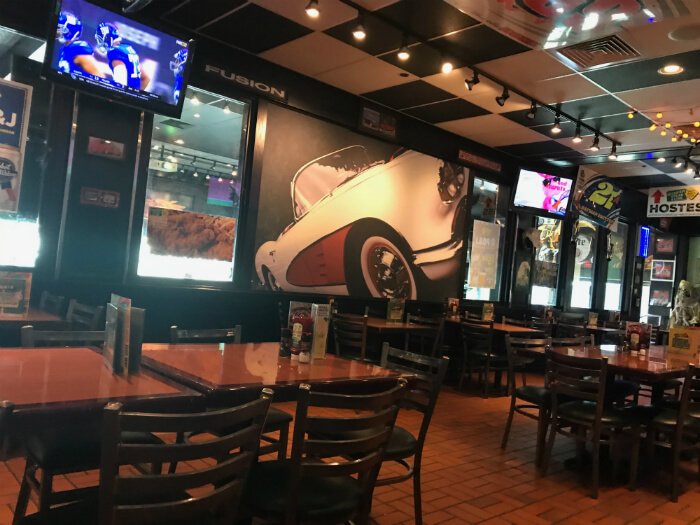 inside Quaker Steak and Lube in Sandusky Ohio with football games on TVs