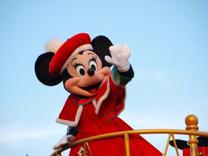 Tokyo Disneyland Christmas parade with Minnie Mouse in red coat