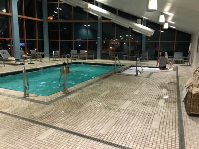 indoor pool and hot tub at night inside Wyndham Grand Pittsburgh Downtown