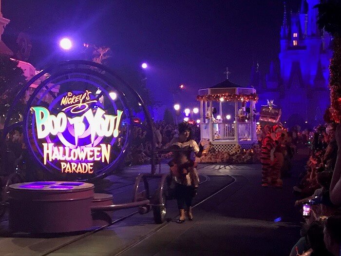 Mickey's Boo To You Halloween Parade beginning float with Magic Kingdom castle in background