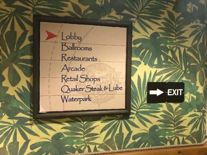 sign inside Castaway Bay hotel in Sandusky with arrow pointing to Lobby, Ballrooms, Restaurants, Arcade, Retail Shops, Quaker Steak & Lube, Waterpark