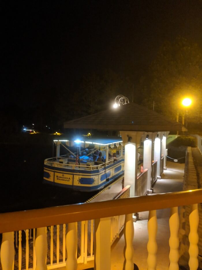 Saratoga Springs Disney hotel boat dock at night