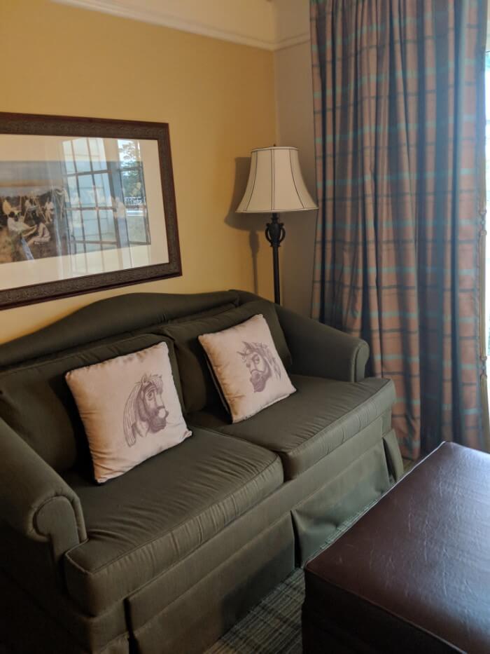 sofa with horse pillows in Saratoga Springs studio villa at Disney hotel