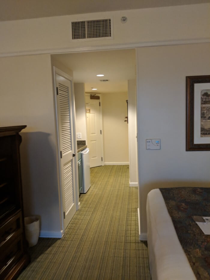 hallway inside Saratoga Springs studio villa leading to kitchen, bathroom, bedroom