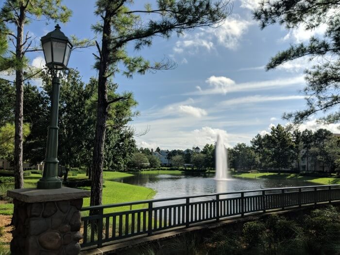 outside at Disney's Saratoga Springs Resort & Spa with lake & fountain