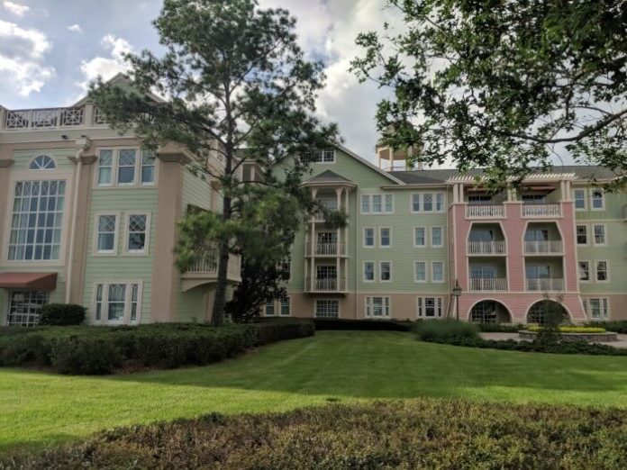 outside green & pink building at Saratoga Springs hotel at Disney World