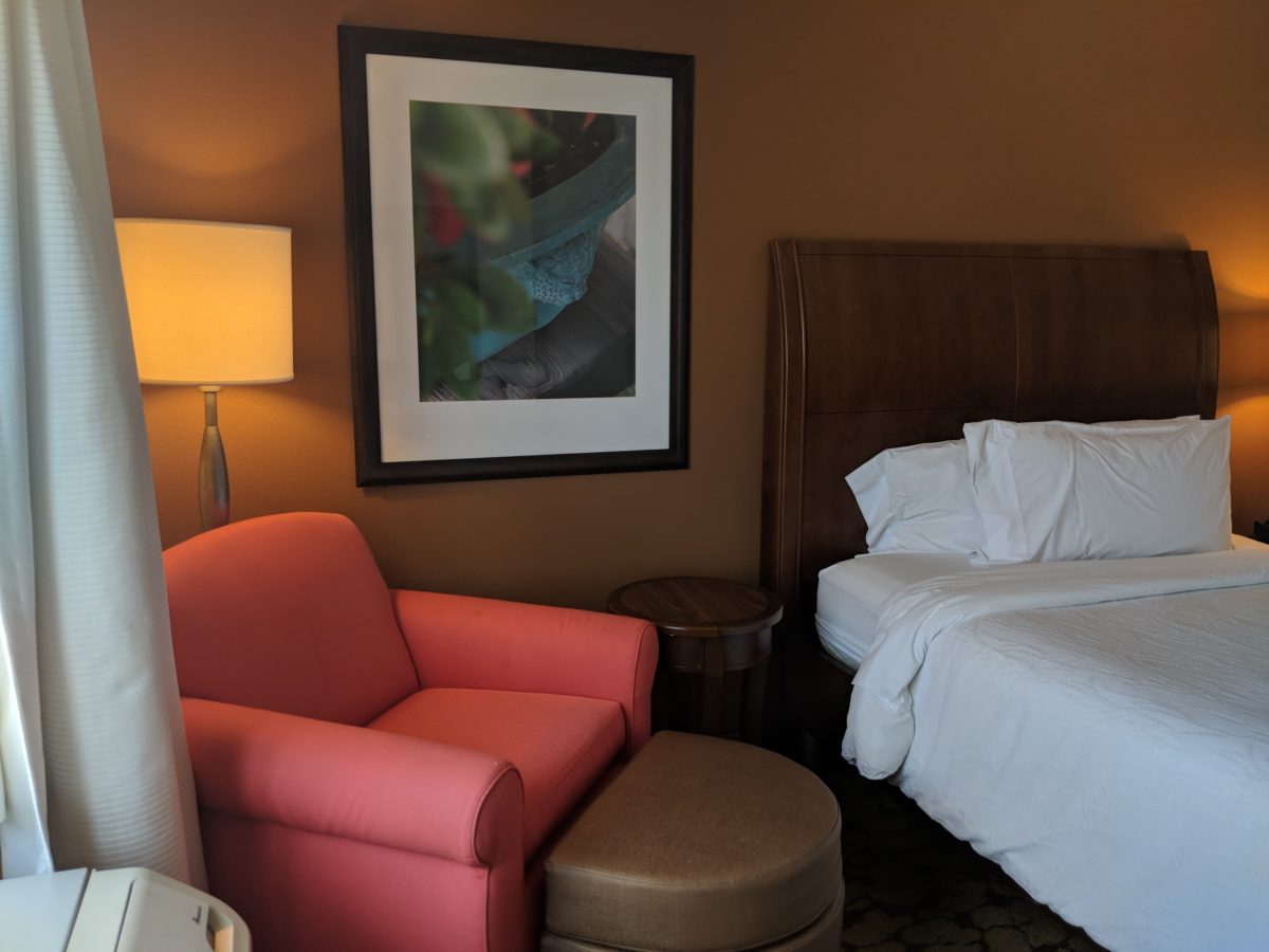 Rooms at Hilton Garden Inn Orlando at SeaWorld have comfortable chairs and beds