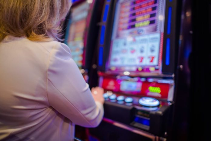 Picture of a woman at a casino. Find out the best Kansas casinos & hotels near them