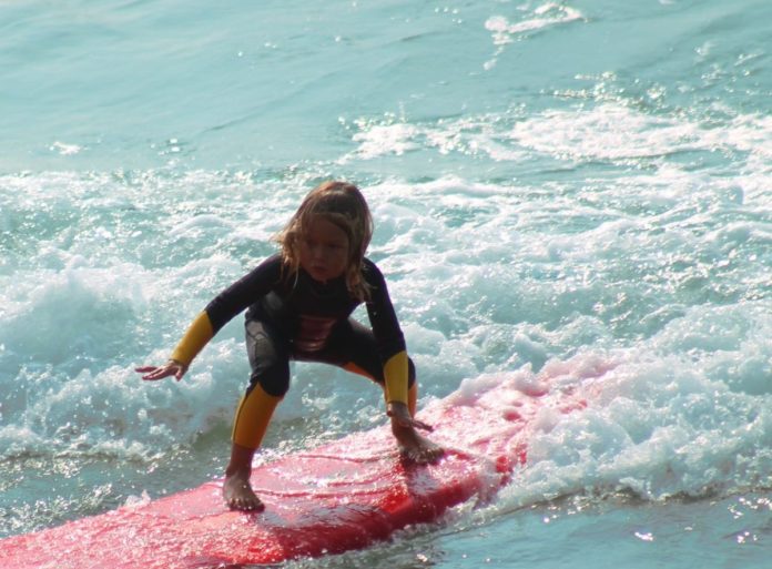 Buy your child a surfboard before your beach vacation