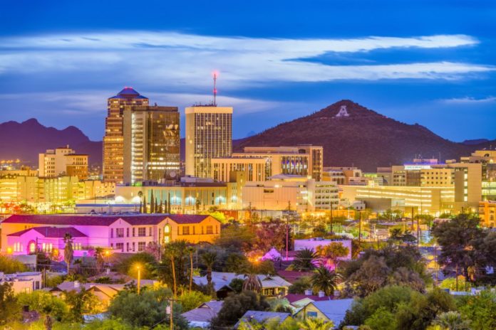 A picture of Tucson, Arizona, USA downtown skyline with Sentinel Peak at dusk. Find out how to get a great deal on Tucson luxury hotels.