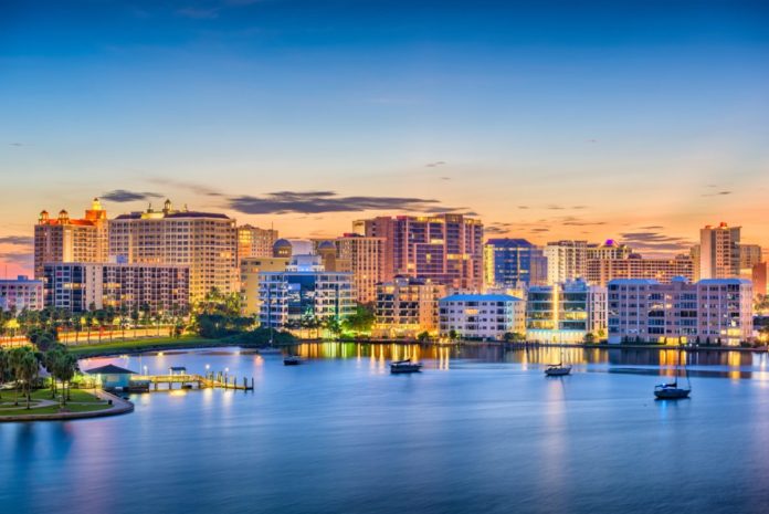 Sarasota, Florida, USA skyline on the bay at dawn. Find out how to get discounted Sarasota hotels.