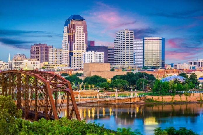 Shreveport, Louisiana, USA skyline over the Red River at dusk. Found out the best luxury hotels in Shreveport