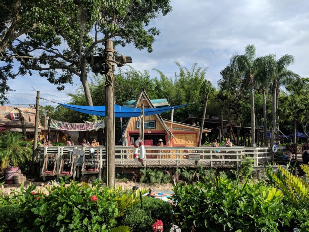 Happy Landings Ice Cream restaurant in Typhoon Lagoon with Castaway Creek lazy river in front