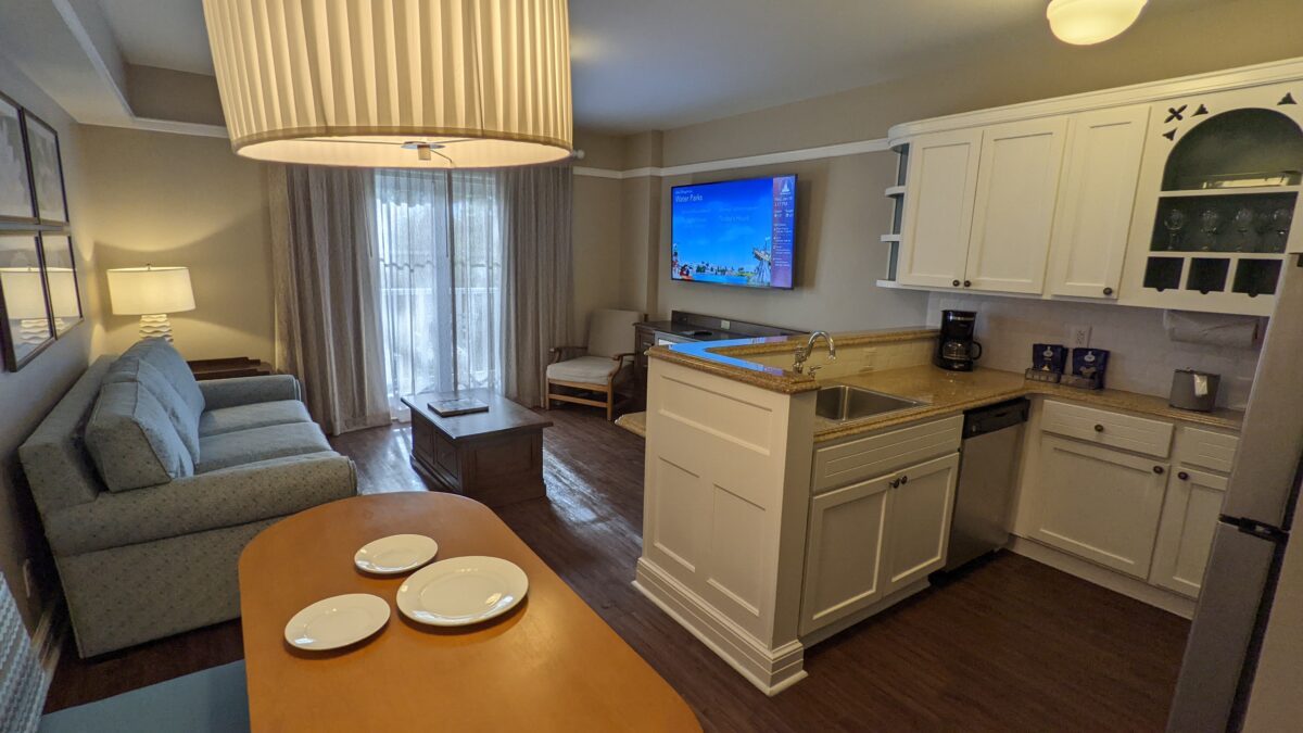 A picture of the kitchen & living room in a one-bedroom villa at Disney's Beach Club in Orlando, Florida