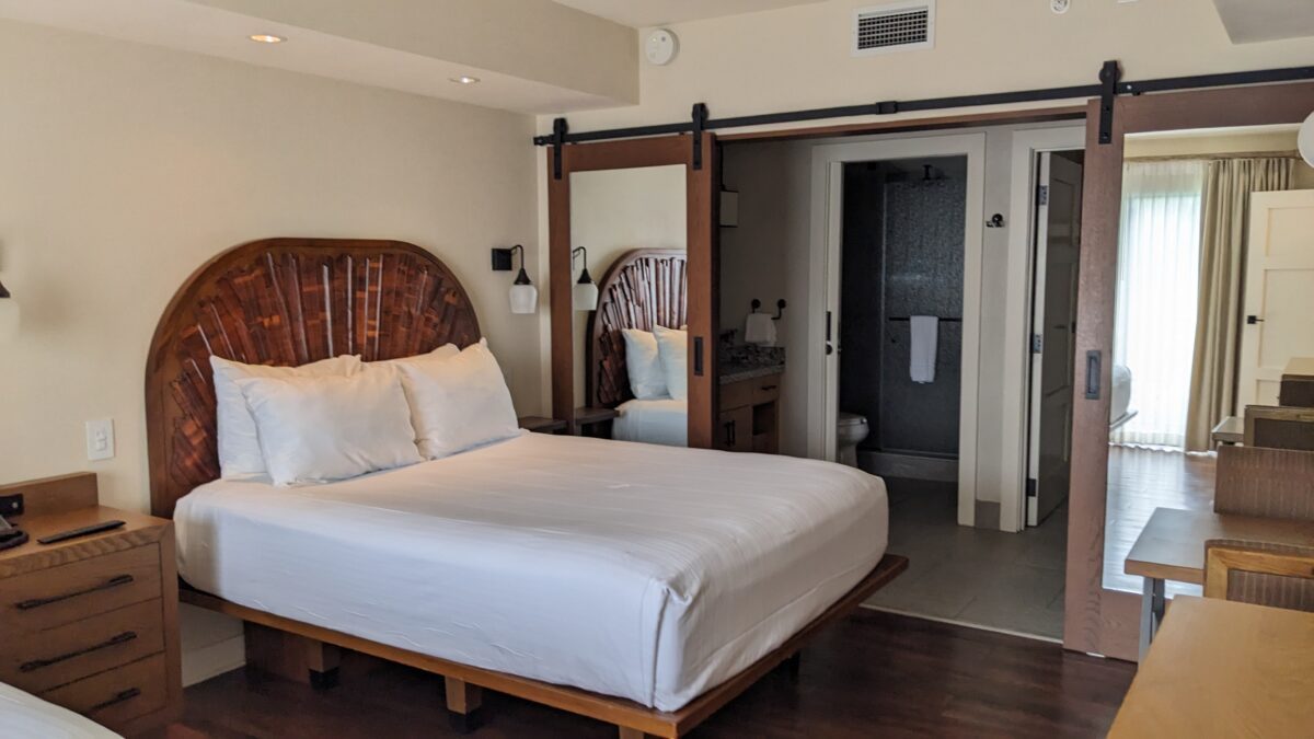 A picture of the second bedroom with two queen beds and its own bathroom at a two-bedroom villa at Wilderness Lodge in Disney World in Orlando, FL