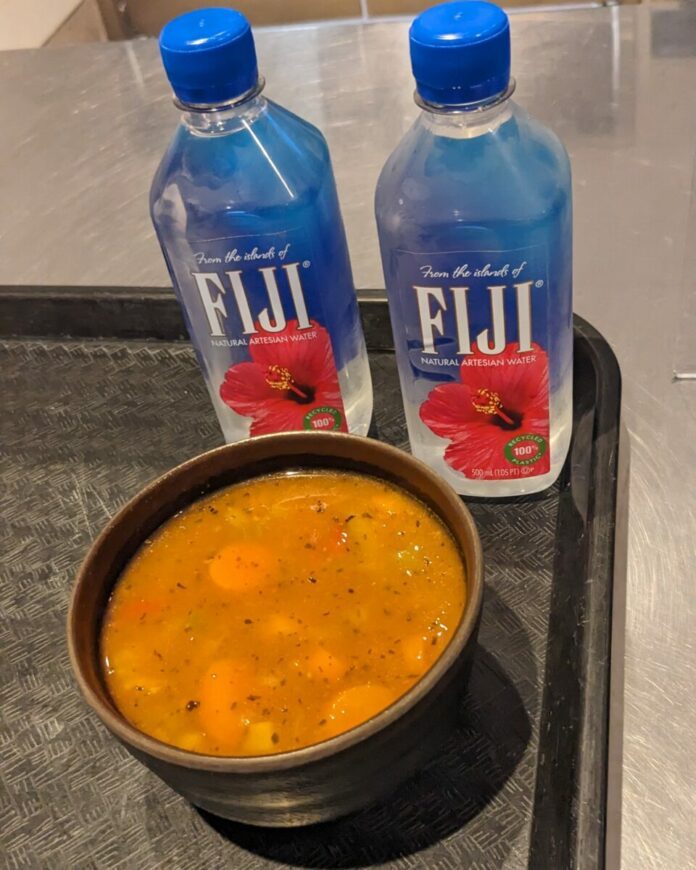 A picture of Vegetable Soup and Fiji Waters we ordered at the Museum Cafe in Colonial Williamsburg in Virginia