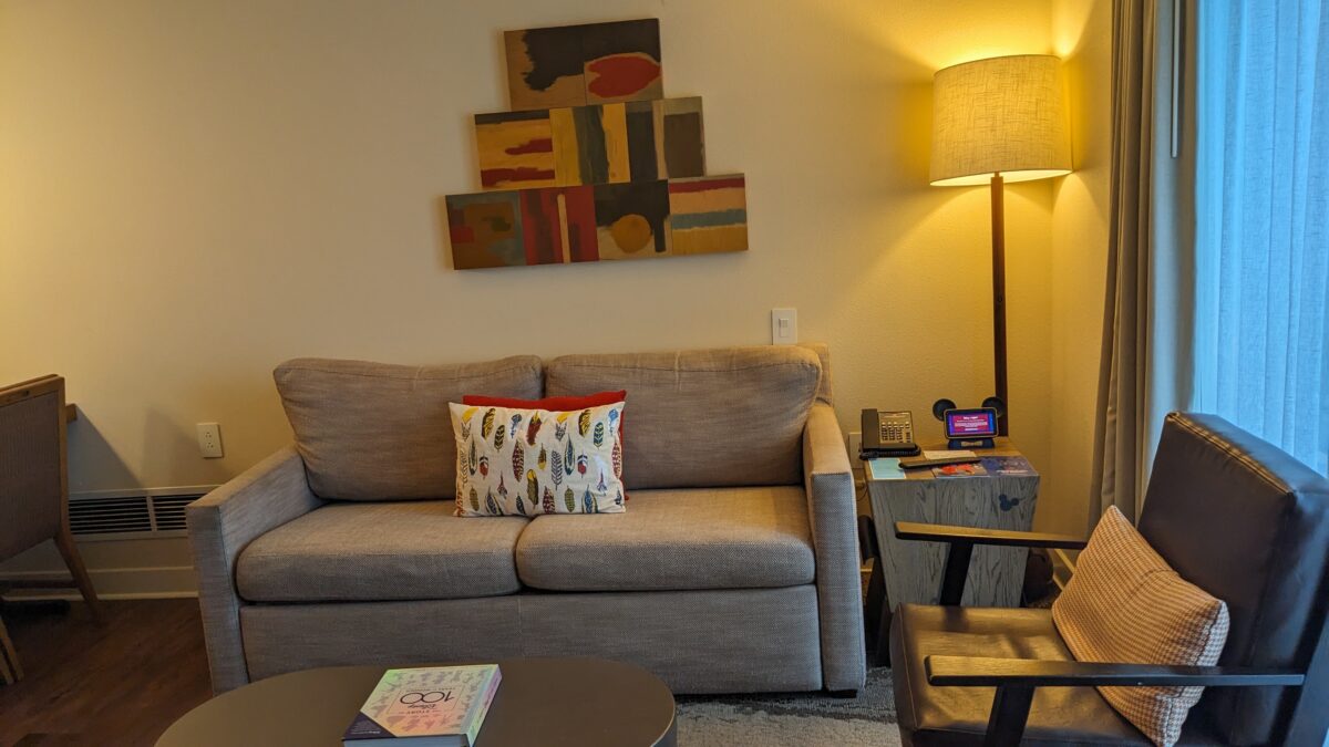 A picture of a sofa in a two-bedroom villa guest room at Wilderness Lodge at the Walt Disney World in Orlando, FL